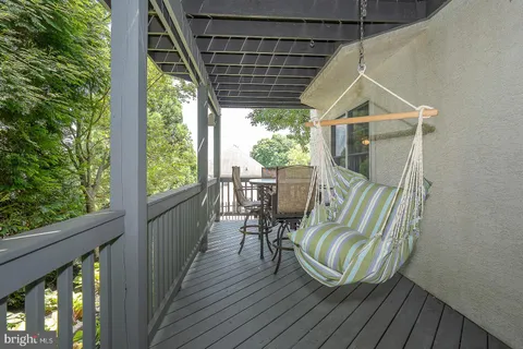 a view of a two chairs in the balcony