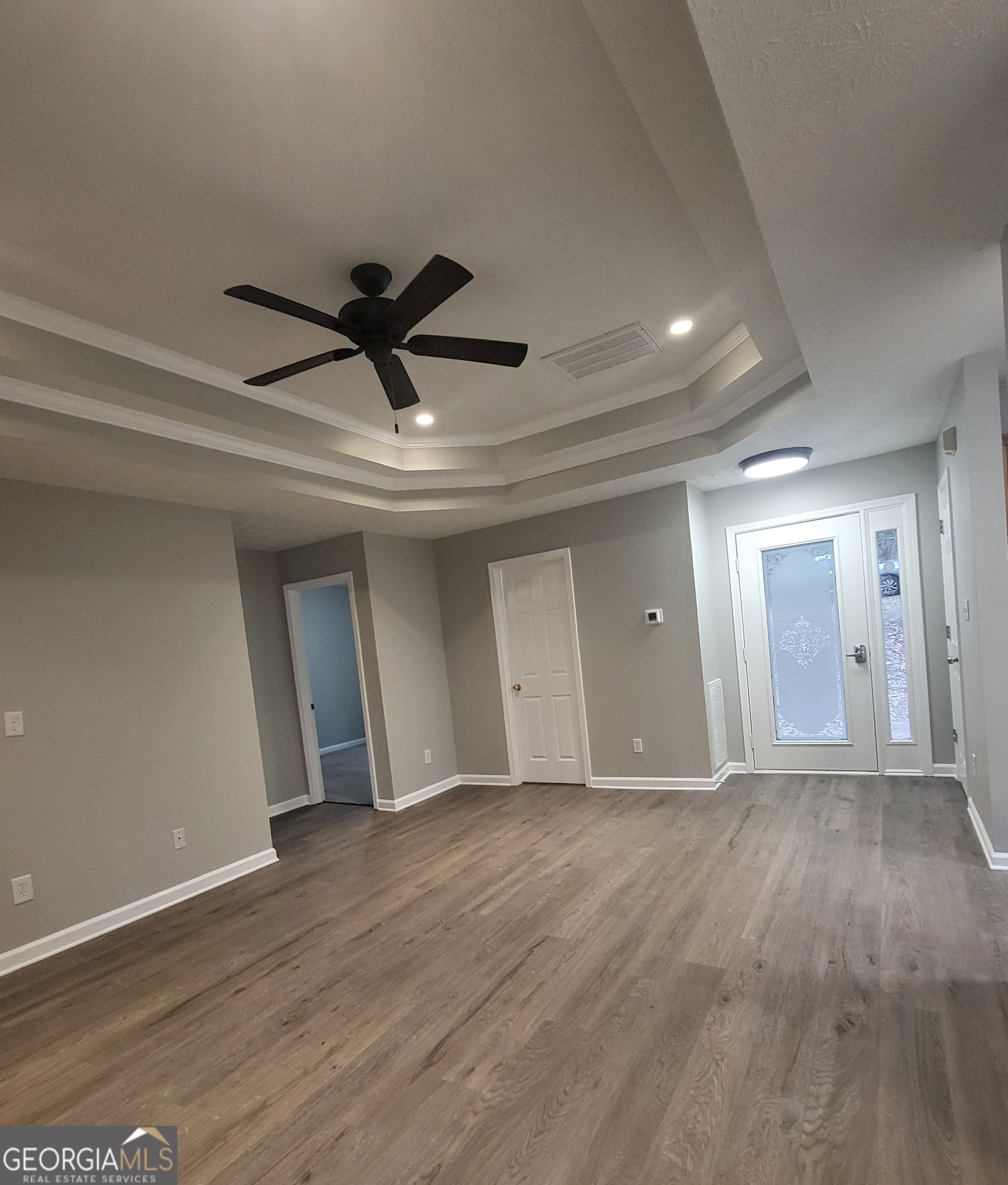 112 Sundown Drive Dawsonville, GA 30534 - Photo 12 of 25 a view of empty room with wooden floor and ceiling fan