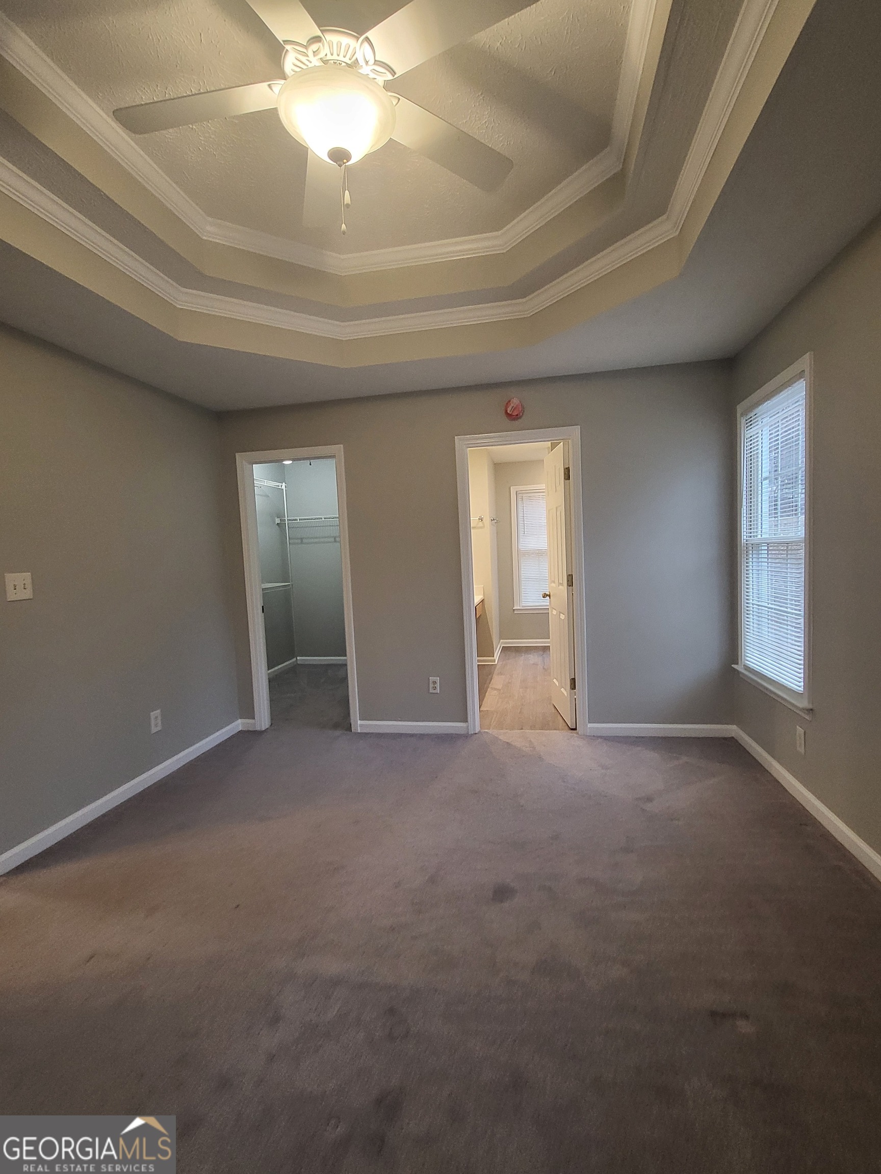 112 Sundown Drive Dawsonville, GA 30534 - Photo 13 of 25 en empty room with windows and ceiling fan