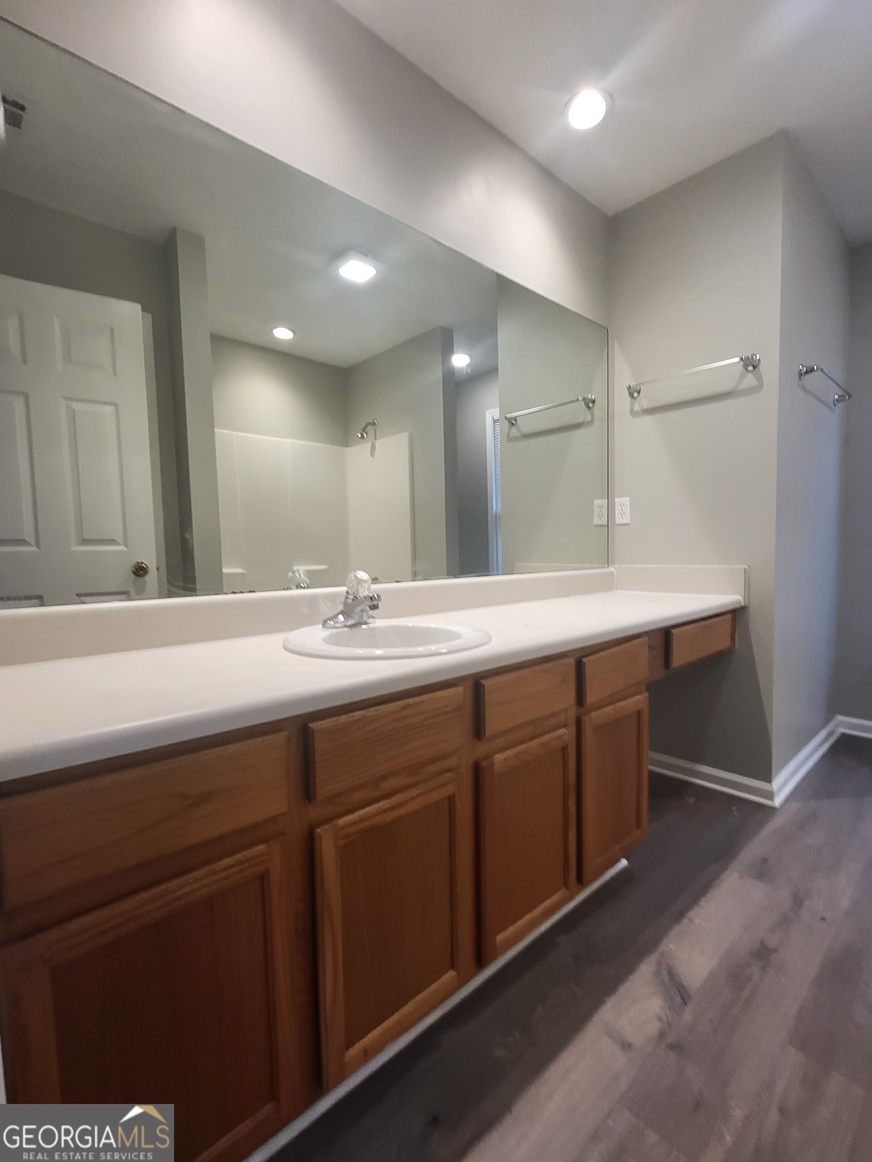 112 Sundown Drive Dawsonville, GA 30534 - Photo 15 of 25 a bathroom with a double vanity sink and a mirror