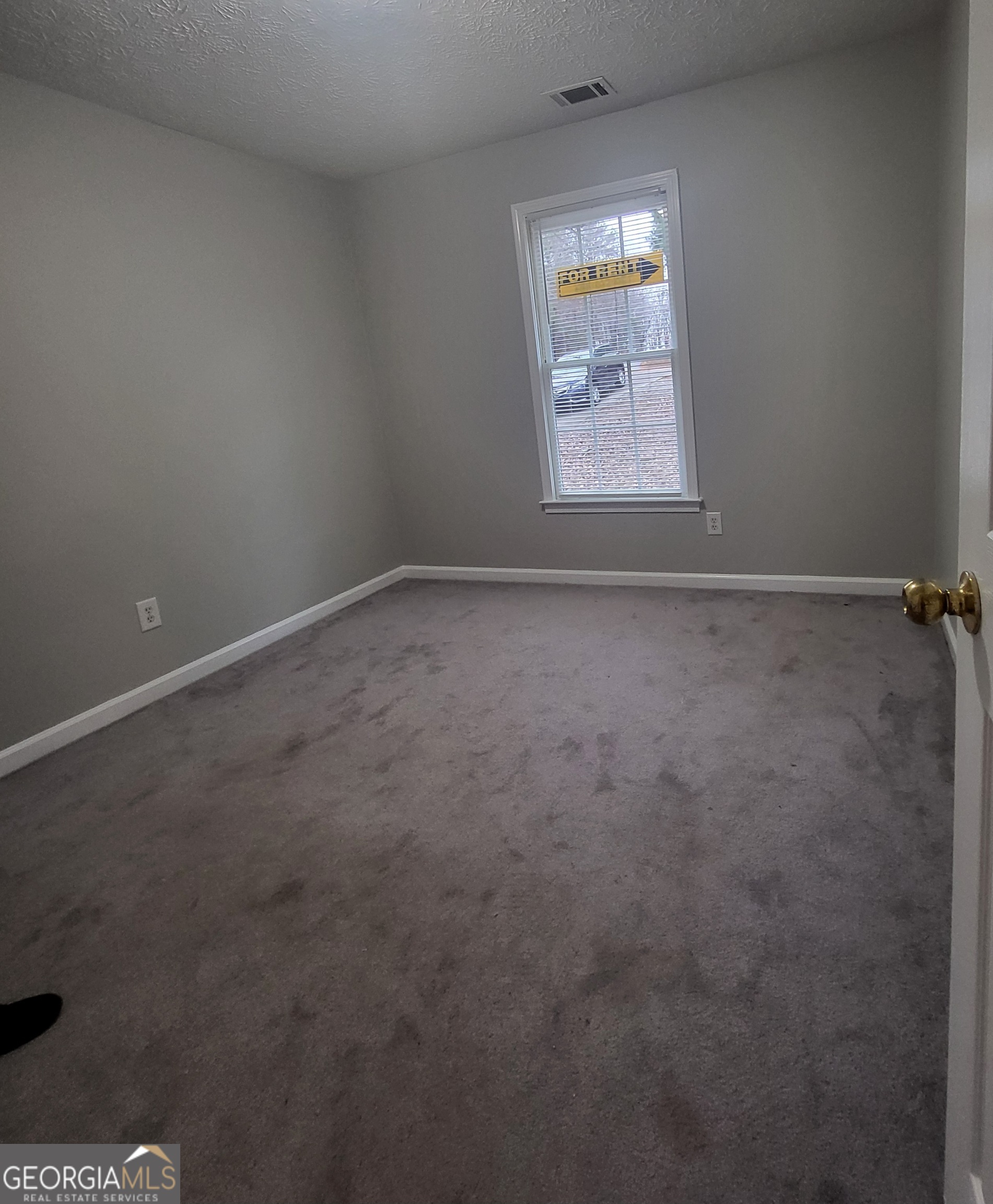 112 Sundown Drive Dawsonville, GA 30534 - Photo 19 of 25 an empty room that has a window