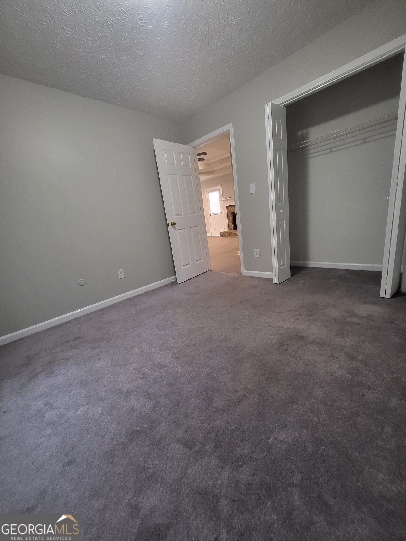 112 Sundown Drive Dawsonville, GA 30534 - Photo 21 of 25 a view of an empty room and closet area