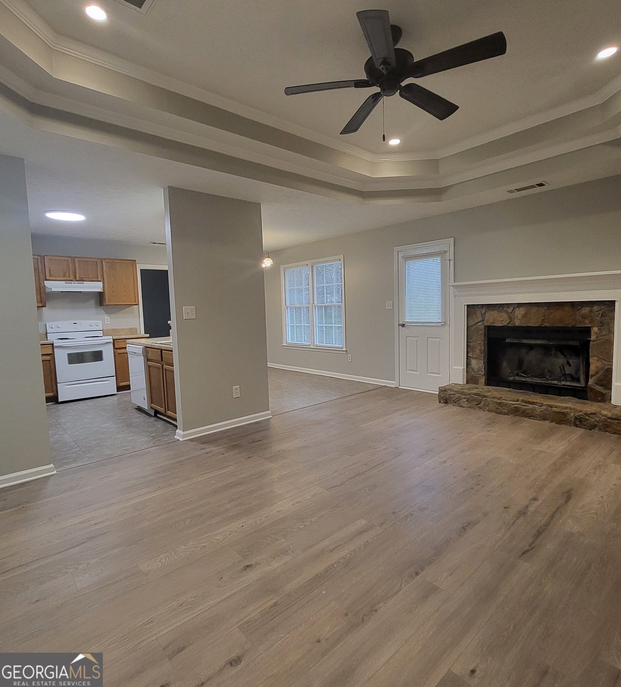 112 Sundown Drive Dawsonville, GA 30534 - Photo 5 of 25 an empty room with furniture and a fireplace