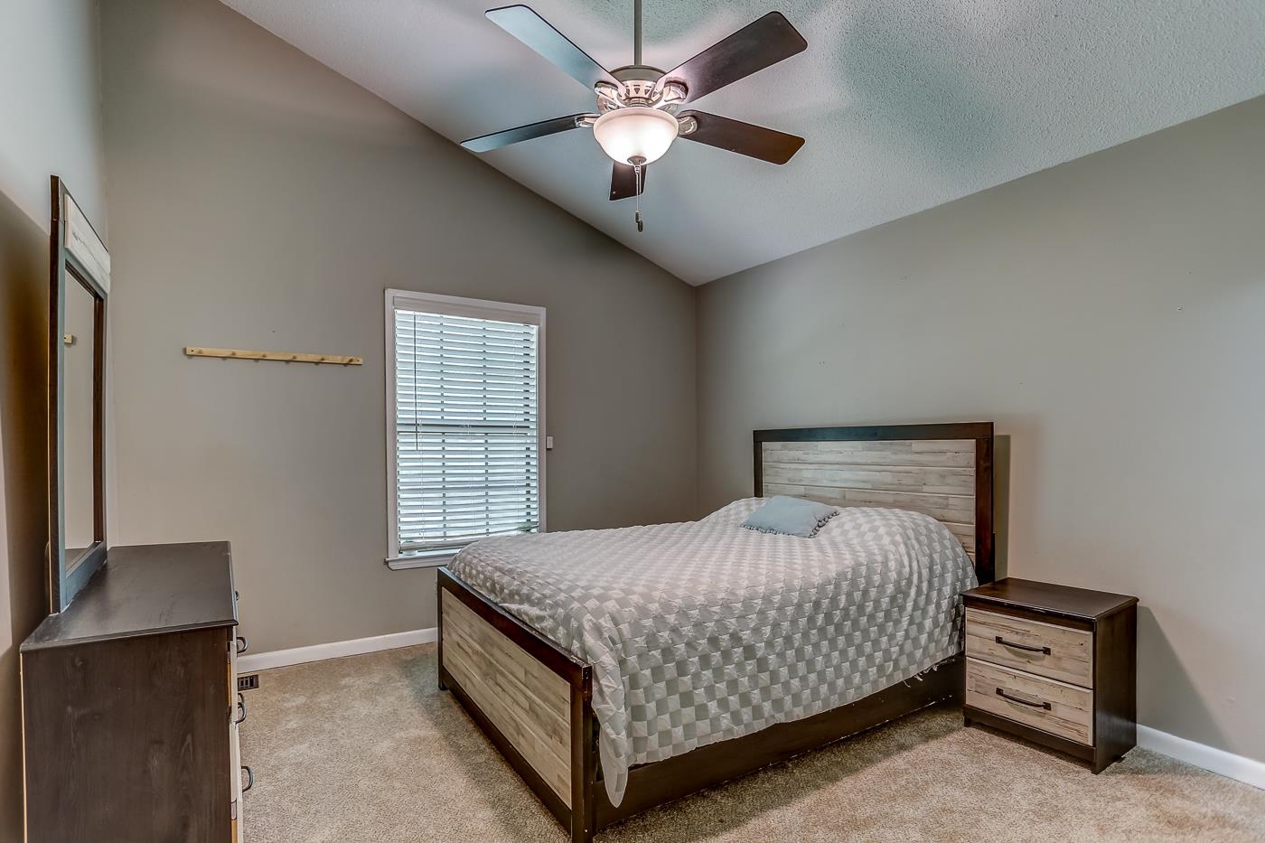 470 Metro Road Eads, TN 38028 - Photo 13 of 40 a bedroom with a bed and a chandelier