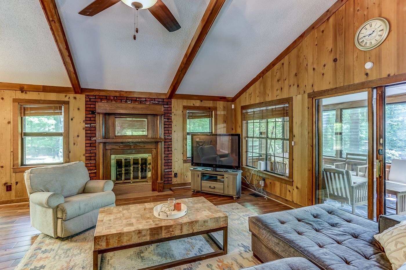 470 Metro Road Eads, TN 38028 - Photo 21 of 40 a living room with furniture a flat screen tv and floor to ceiling window