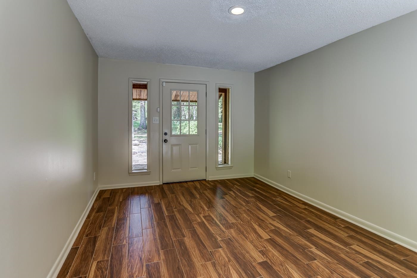 470 Metro Road Eads, TN 38028 - Photo 4 of 40 an empty room with wooden floor and windows