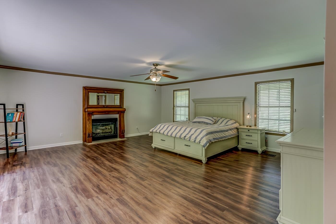 470 Metro Road Eads, TN 38028 - Photo 6 of 40 a spacious bedroom with a bed a dresser and wooden floor