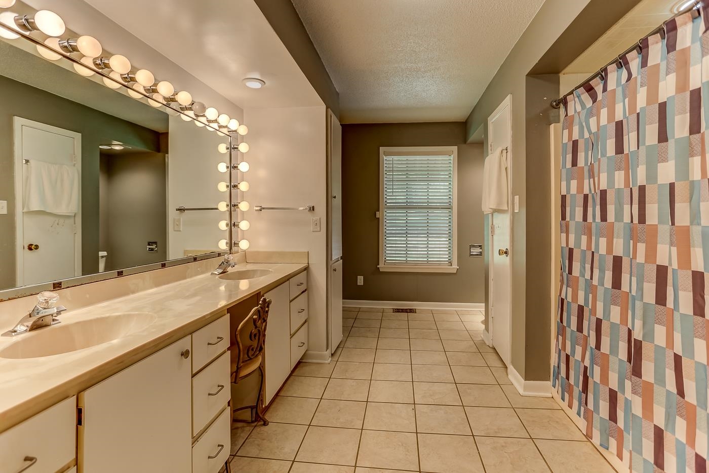 470 Metro Road Eads, TN 38028 - Photo 9 of 40 a spacious bathroom with a double vanity sink a mirror and a shower
