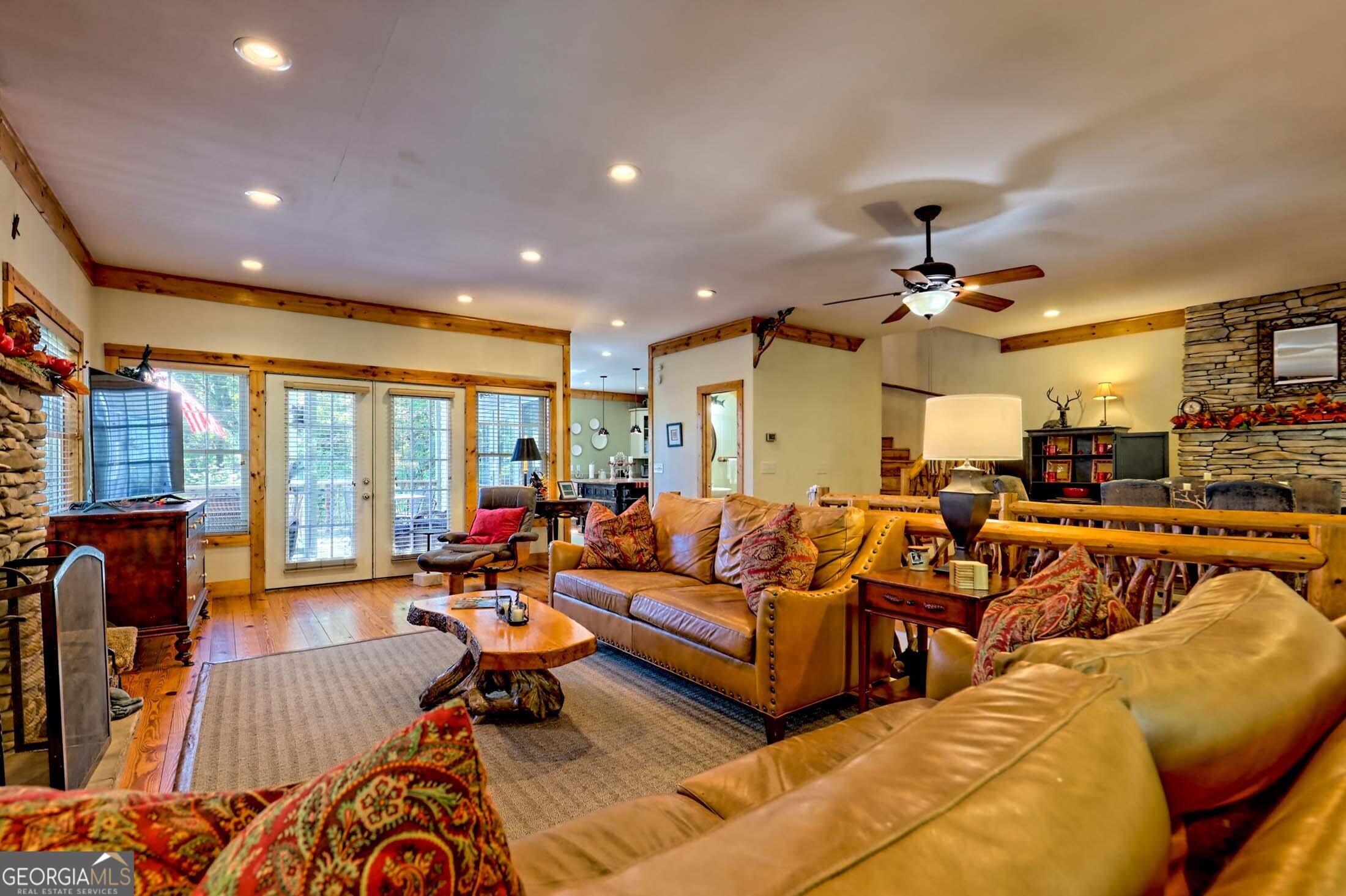 3315 Bald Mountain Road Dillard, GA 30537 - Photo 12 of 79 a living room with furniture ceiling fan and a large window