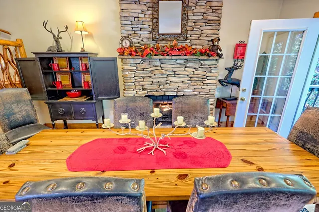 a view of a balcony with chairs and wooden floor