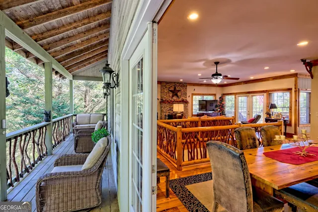 a view of a hallway view with wooden floor and staircase