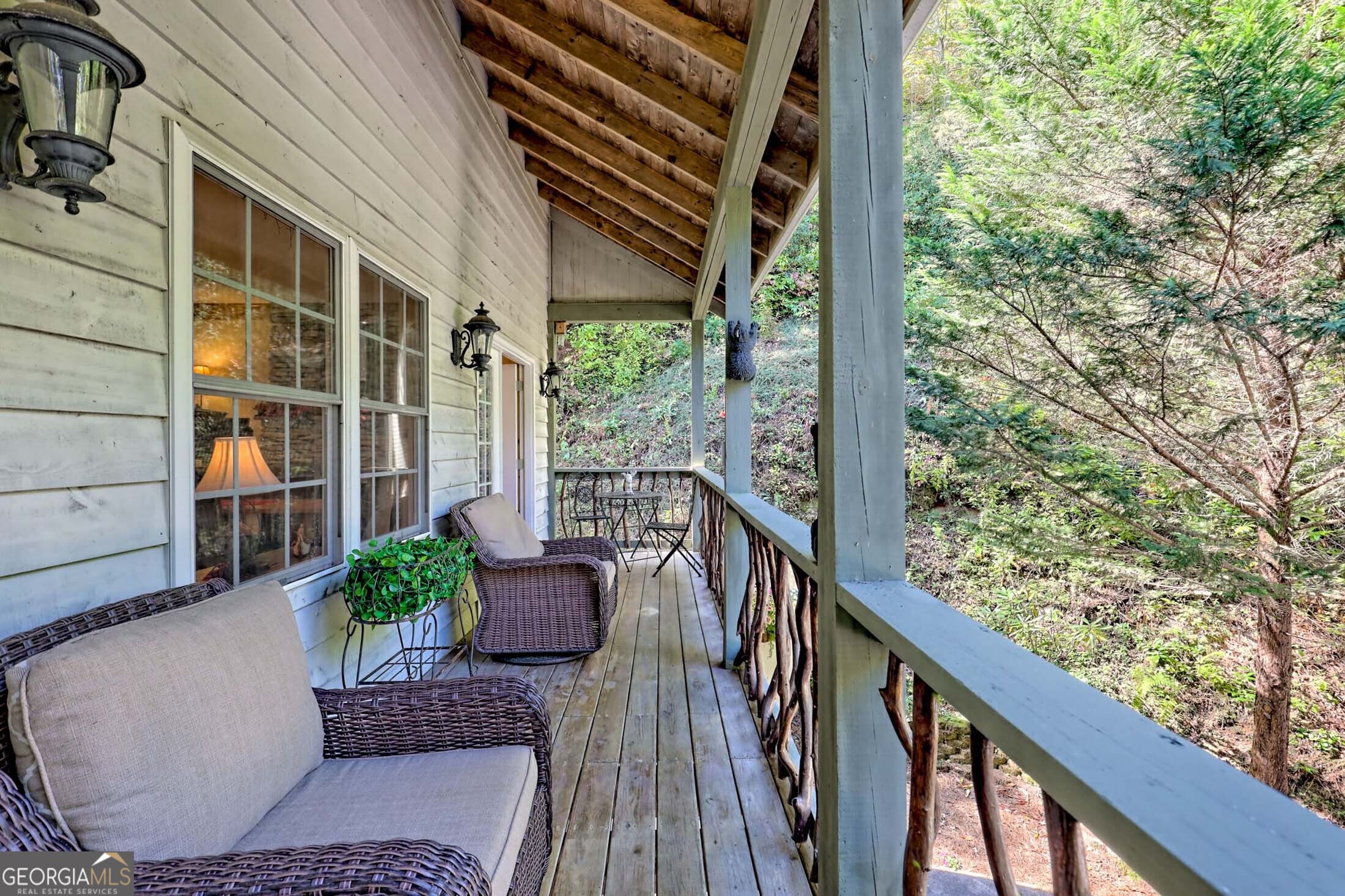 3315 Bald Mountain Road Dillard, GA 30537 - Photo 20 of 79 a view of balcony with wooden floor and outdoor seating