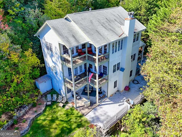 a view of a patio with a table and chairs and wooden floor