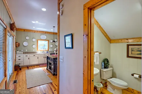 a balcony with table and chairs