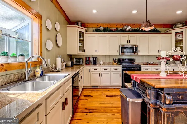 a bedroom with a large bed and a large window