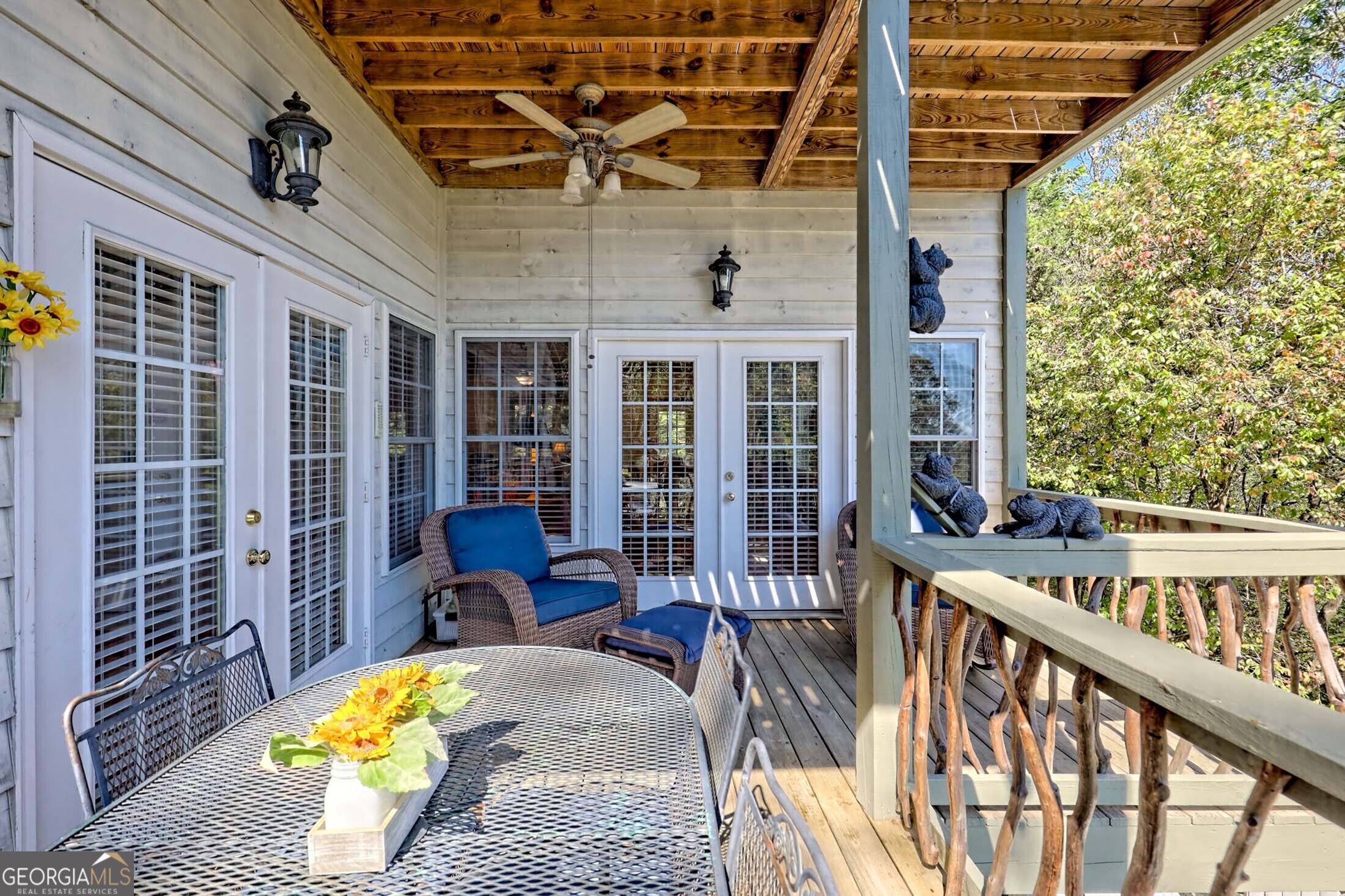 3315 Bald Mountain Road Dillard, GA 30537 - Photo 32 of 79 a view of a balcony with chairs and wooden floor