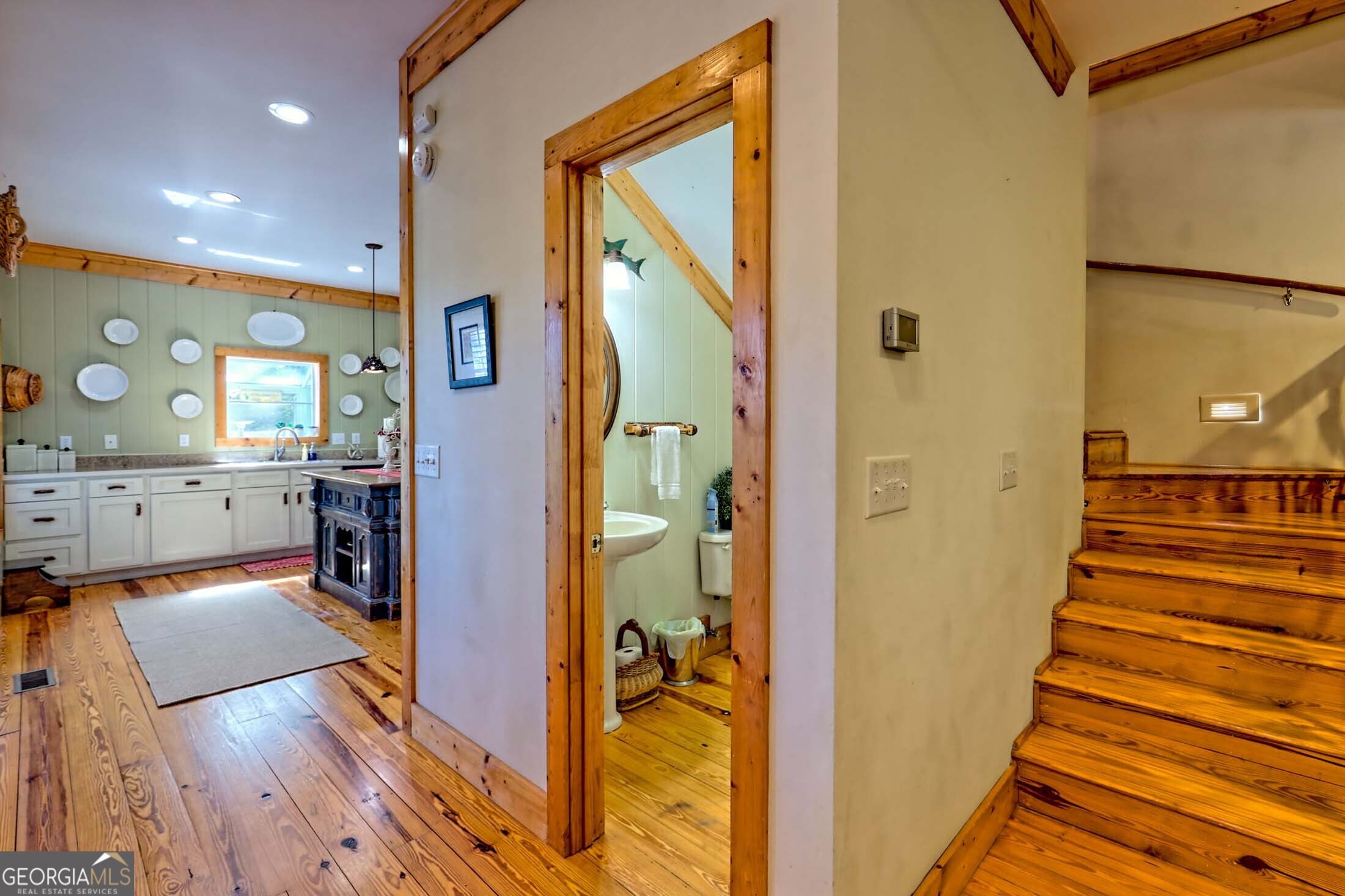 3315 Bald Mountain Road Dillard, GA 30537 - Photo 33 of 79 a view of a hallway view with wooden floor and staircase