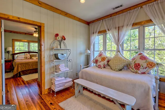 a bedroom with furniture and a fireplace