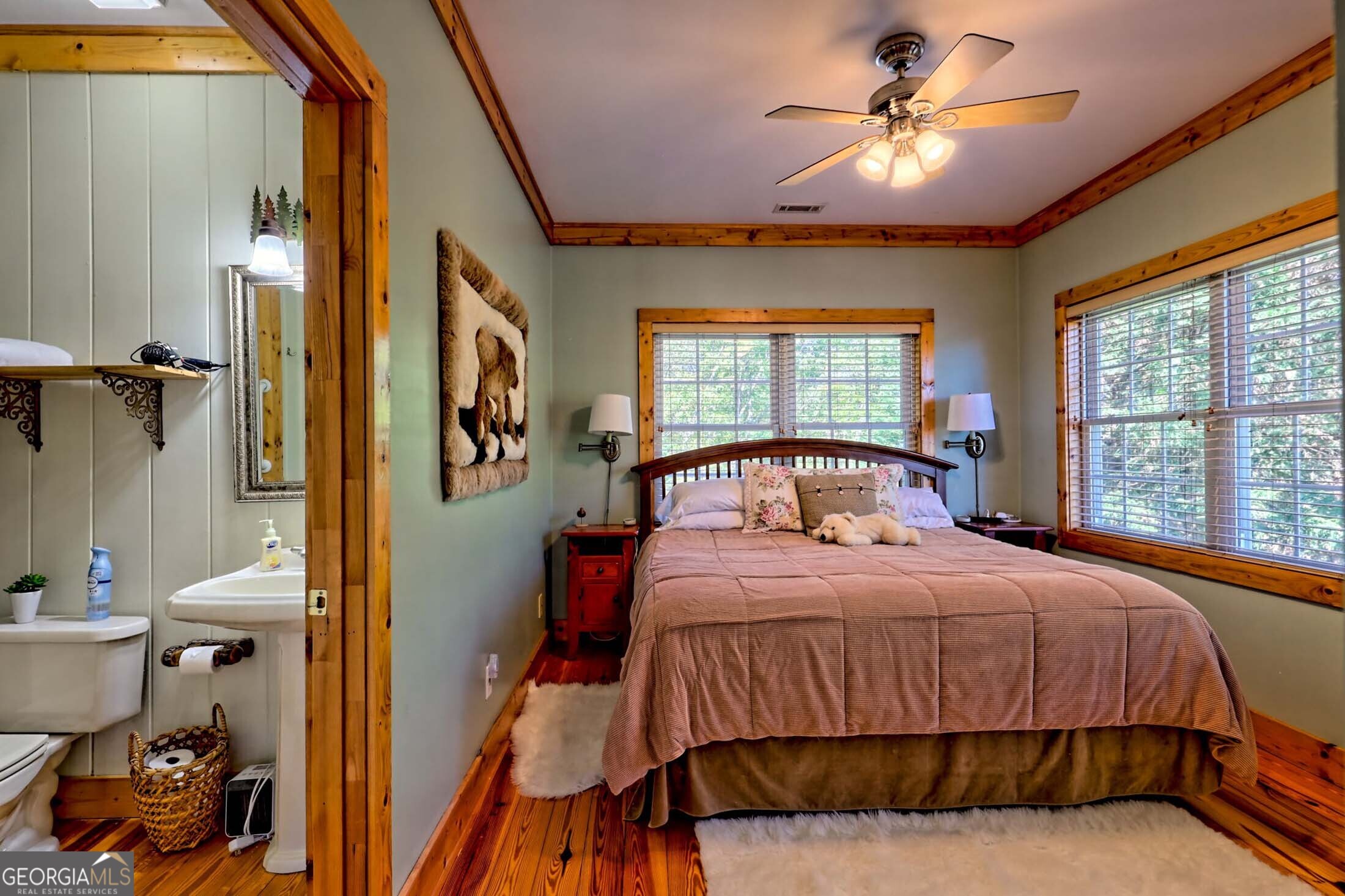 3315 Bald Mountain Road Dillard, GA 30537 - Photo 41 of 79 a bedroom with a bed and a chandelier