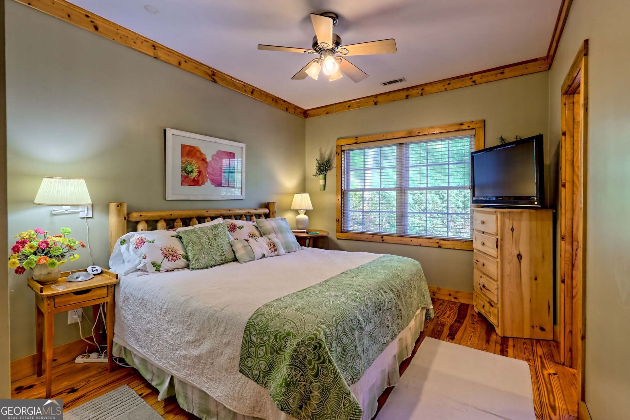 3315 Bald Mountain Road Dillard, GA 30537 - Photo 47 of 79 a bedroom with a bed and a flat screen tv