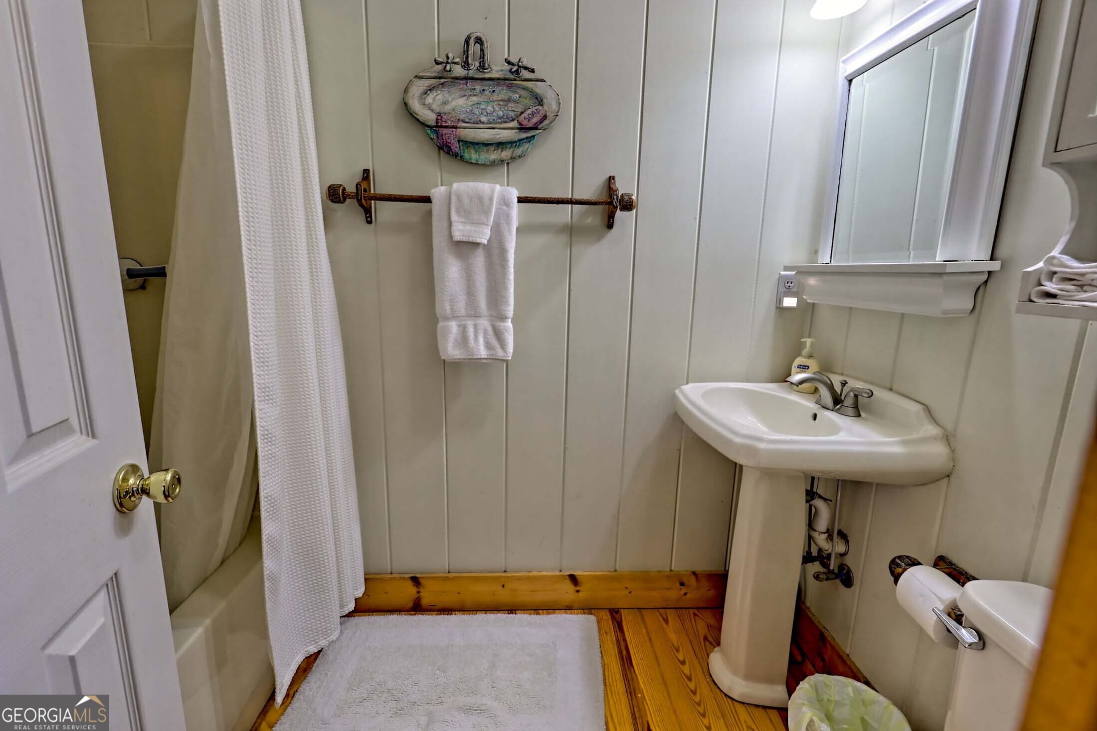 3315 Bald Mountain Road Dillard, GA 30537 - Photo 54 of 79 a bathroom with a sink and mirror