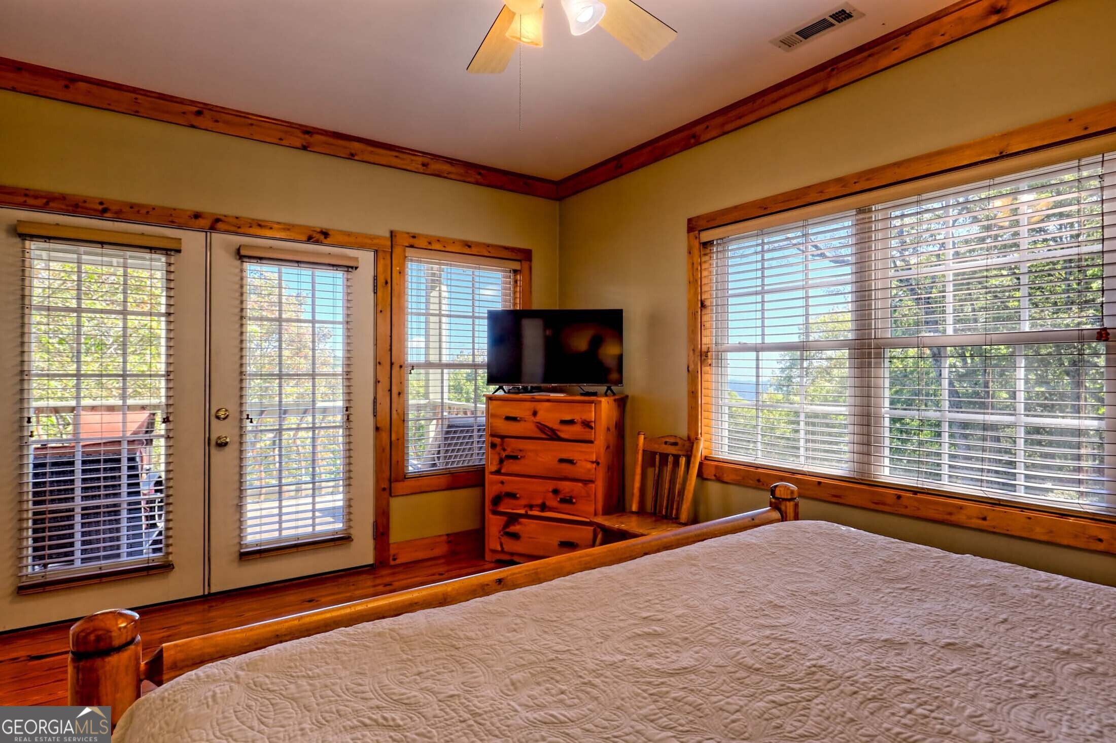 3315 Bald Mountain Road Dillard, GA 30537 - Photo 55 of 79 a bedroom with furniture and a flat screen tv