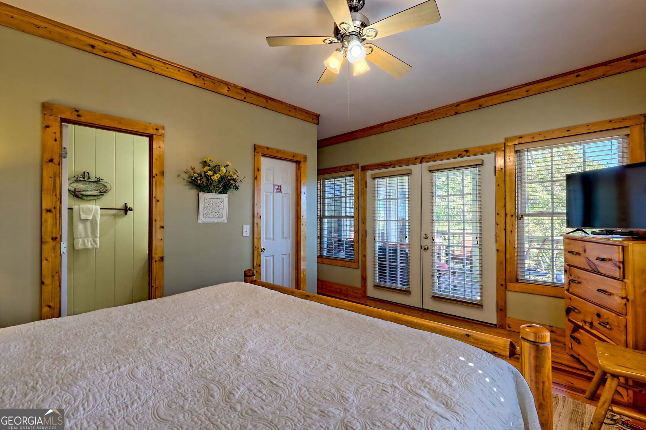 3315 Bald Mountain Road Dillard, GA 30537 - Photo 56 of 79 a bedroom with a bed and a flat screen tv