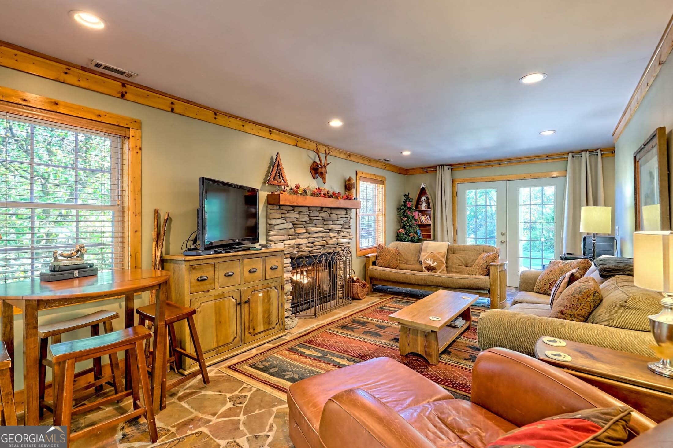 3315 Bald Mountain Road Dillard, GA 30537 - Photo 60 of 79 a living room with furniture and a flat screen tv