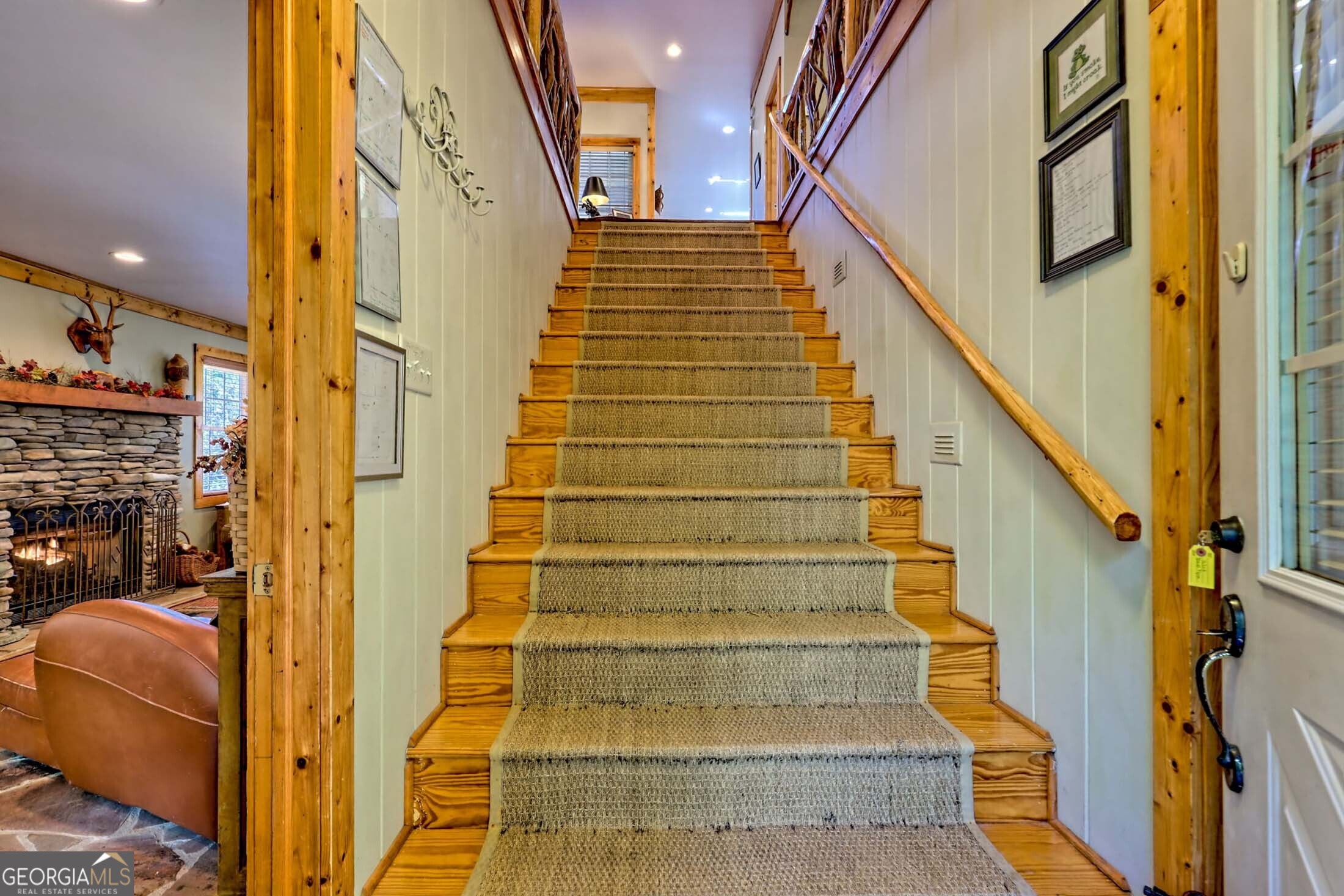 3315 Bald Mountain Road Dillard, GA 30537 - Photo 6 of 79 a view of staircase with railing and frames on wall