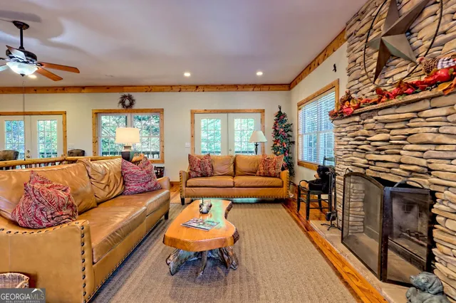 a dining room with furniture a rug and a fireplace
