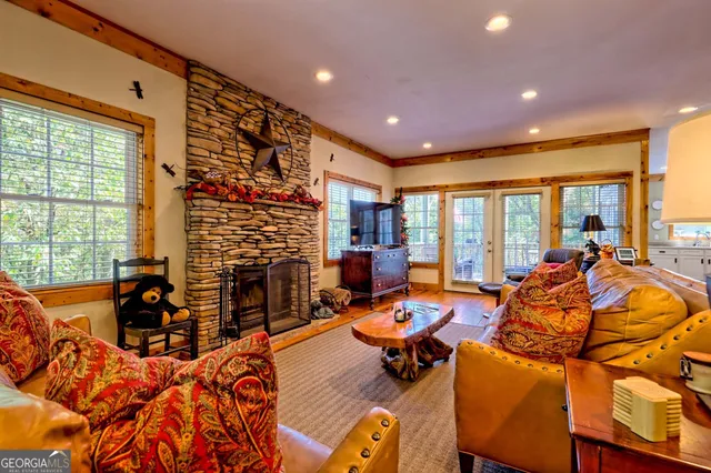 a view of gym equipment with lots of frames on wall and a large window