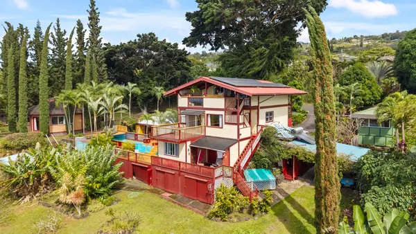an aerial view of a house with swimming pool