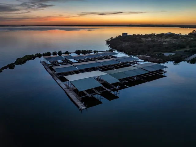 a view of a swimming pool with sitting area