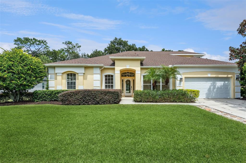 a front view of a house with a yard