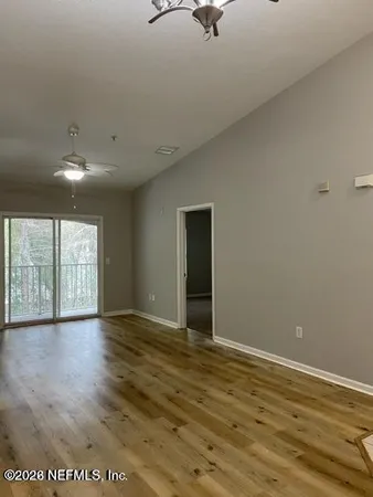 a view of an empty room with a window