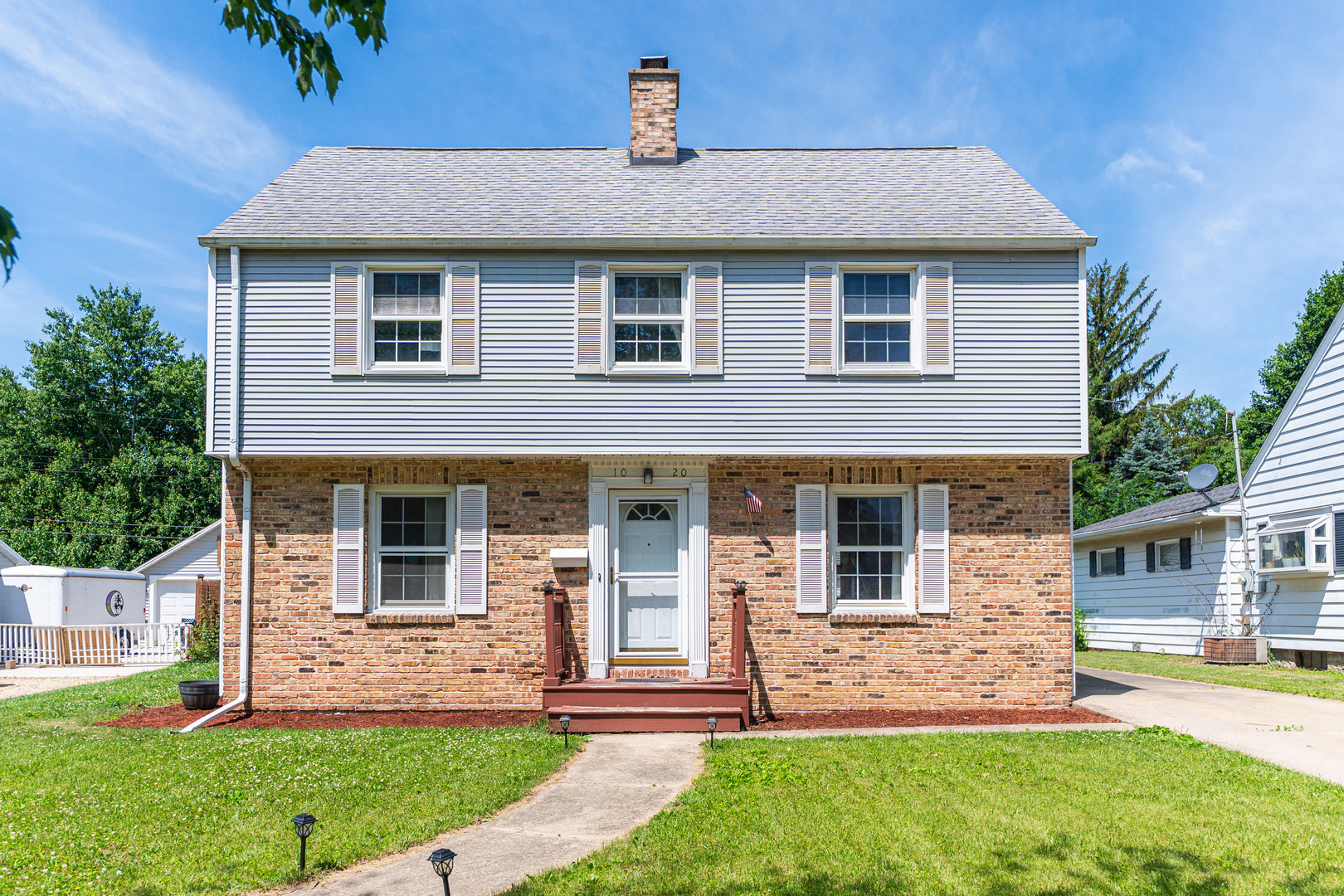1020 North 8th Street Rochelle, IL 61068 - Photo 1 of 21 a front view of a house with a yard