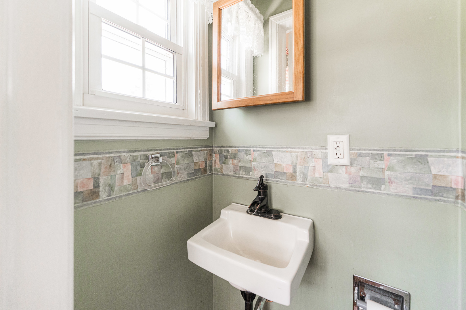 1020 North 8th Street Rochelle, IL 61068 - Photo 11 of 21 a bathroom with a sink and a window
