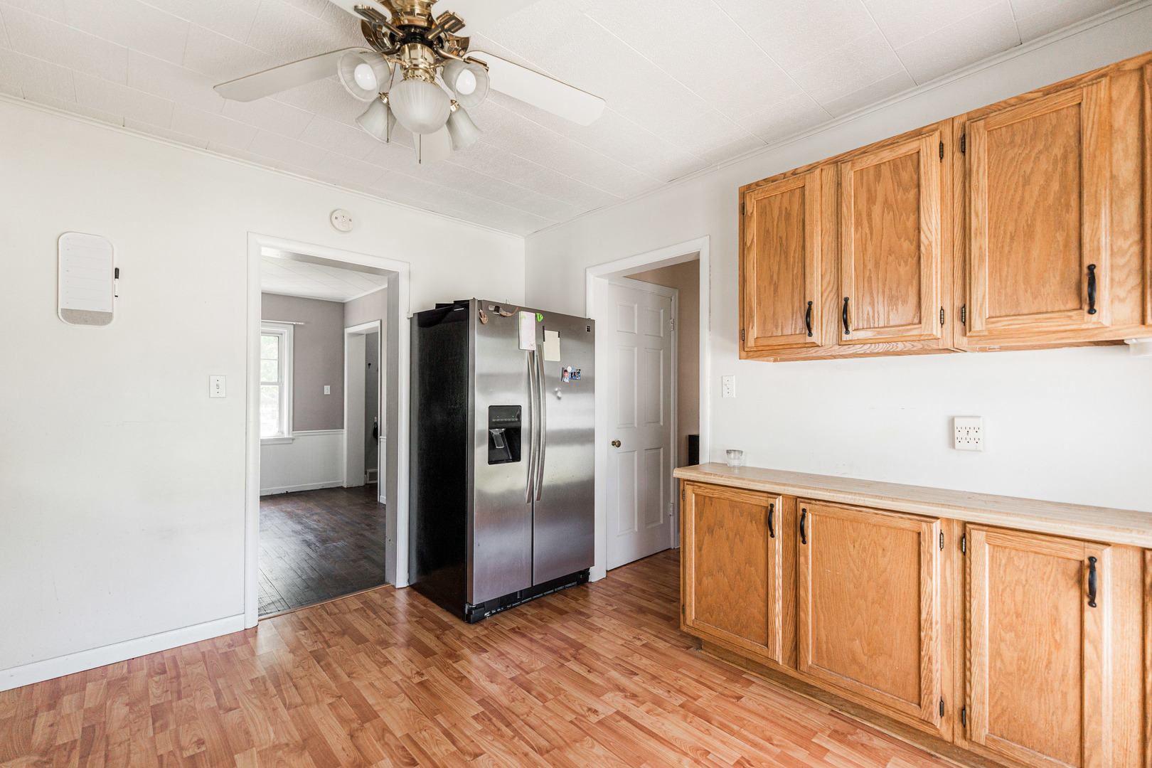 1020 North 8th Street Rochelle, IL 61068 - Photo 9 of 21 a view of a kitchen with wooden floor and a window