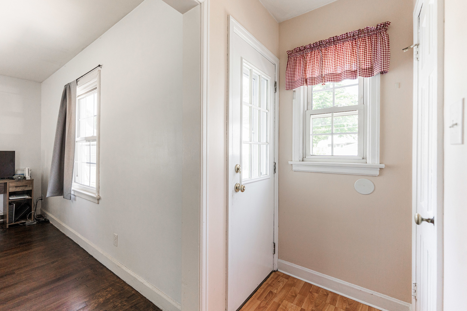 1020 North 8th Street Rochelle, IL 61068 - Photo 10 of 21 a view of an empty room with wooden floor and a window