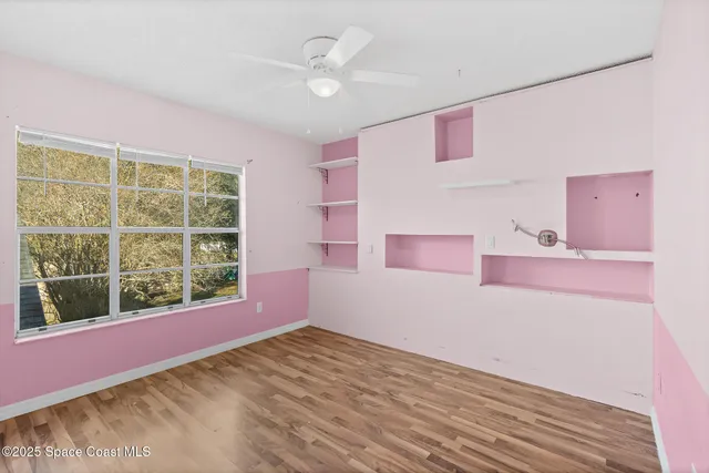 a view of livingroom with furniture window and front door