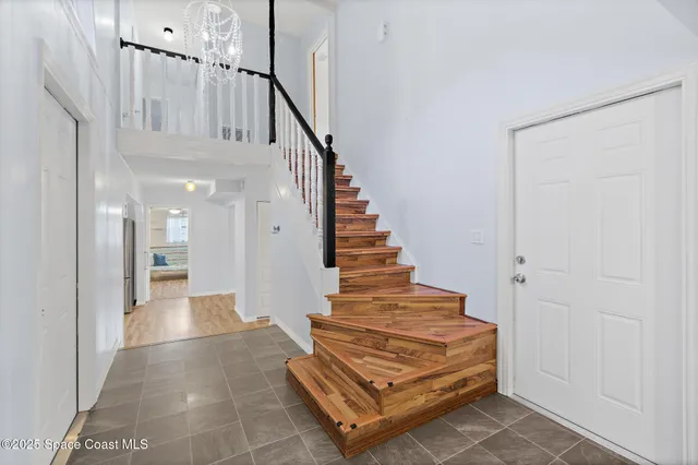 a view of entryway with dining room and stairs