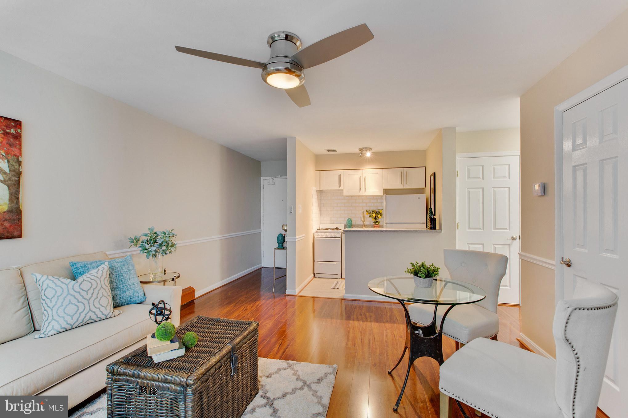 513 12th Street Northeast, Unit 3 Washington, DC 20002 - Photo 1 of 11 a living room with furniture and a kitchen view