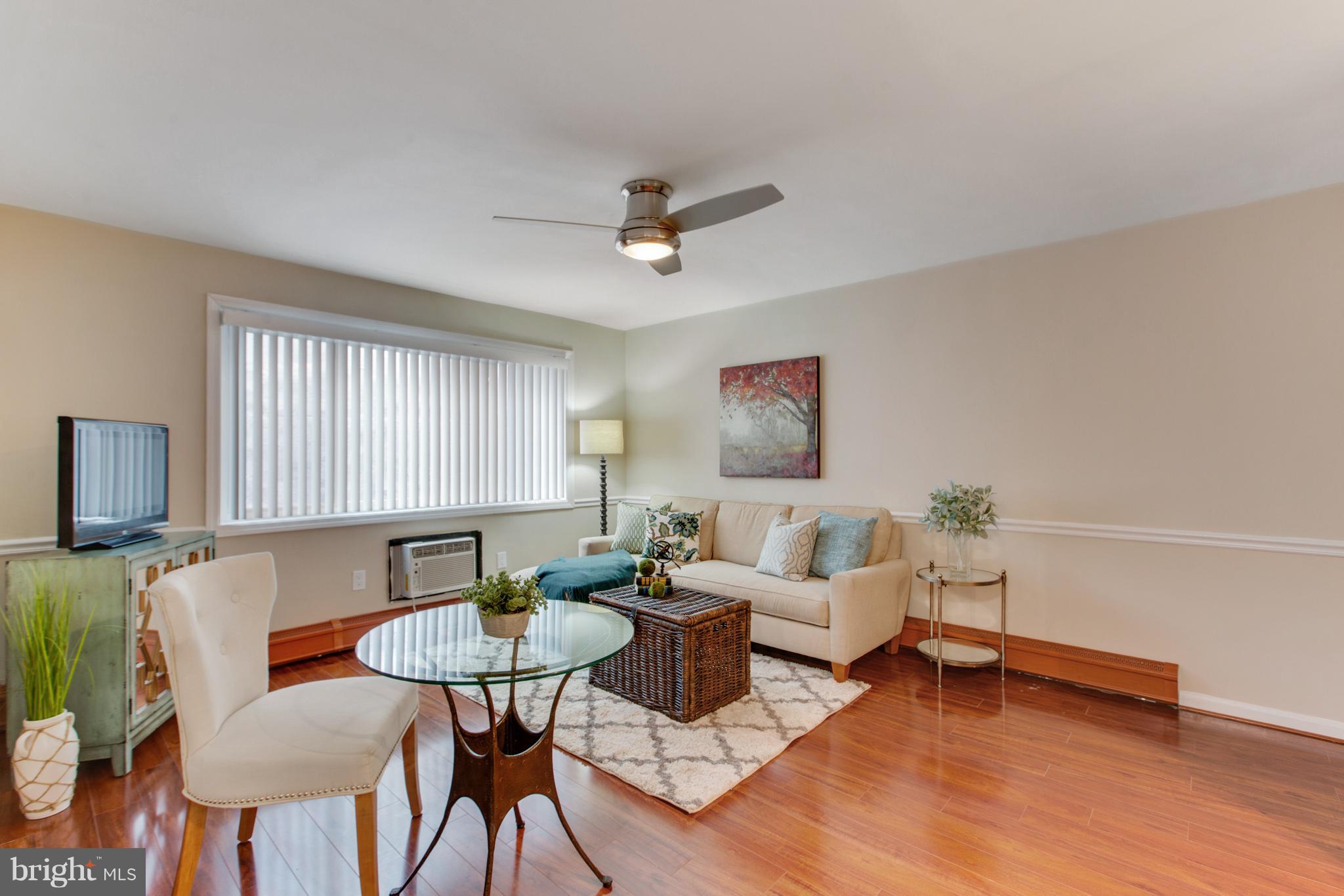 513 12th Street Northeast, Unit 3 Washington, DC 20002 - Photo 2 of 11 a living room with furniture a flat screen tv and a window