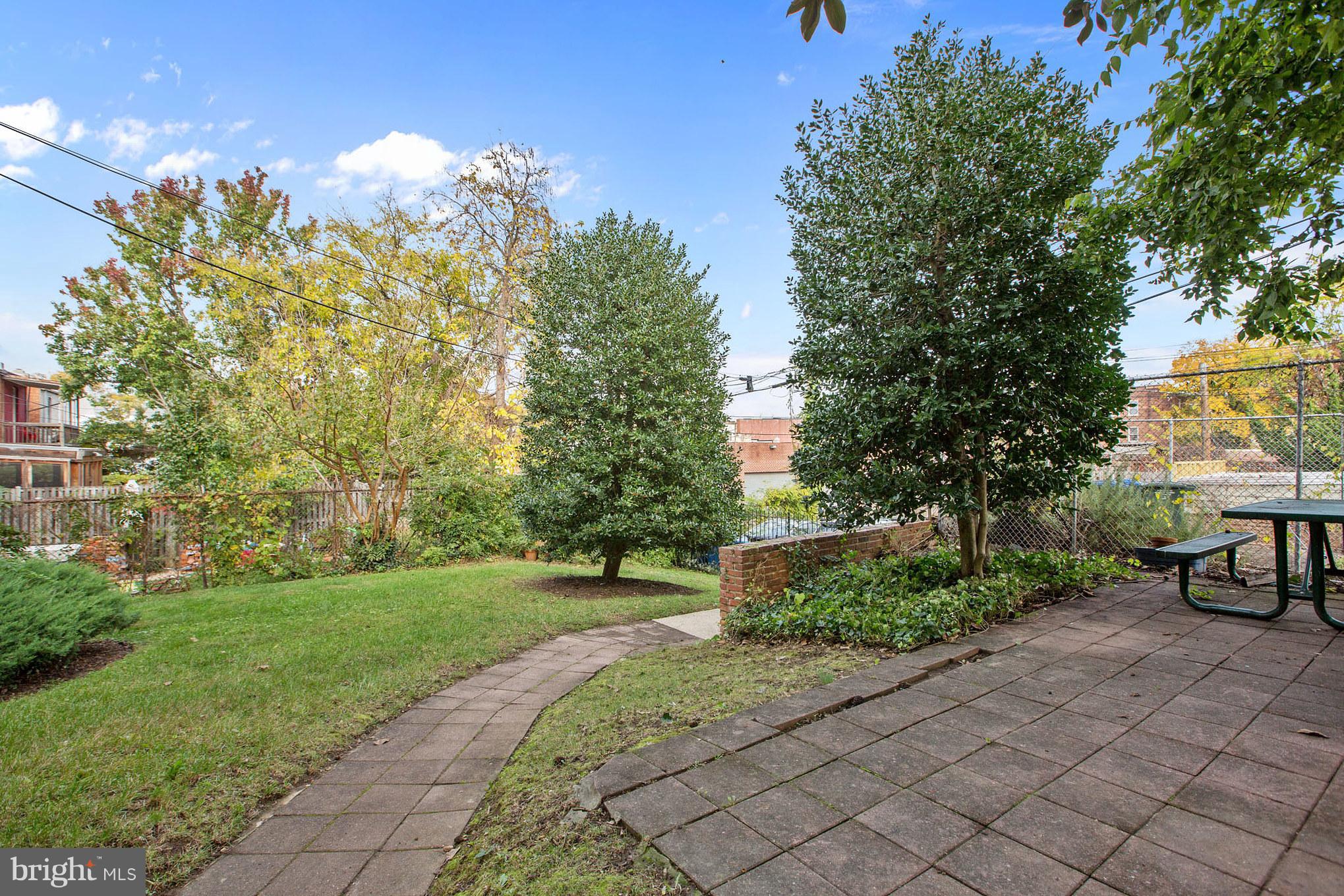 513 12th Street Northeast, Unit 3 Washington, DC 20002 - Photo 11 of 11 a view of a garden with a bench