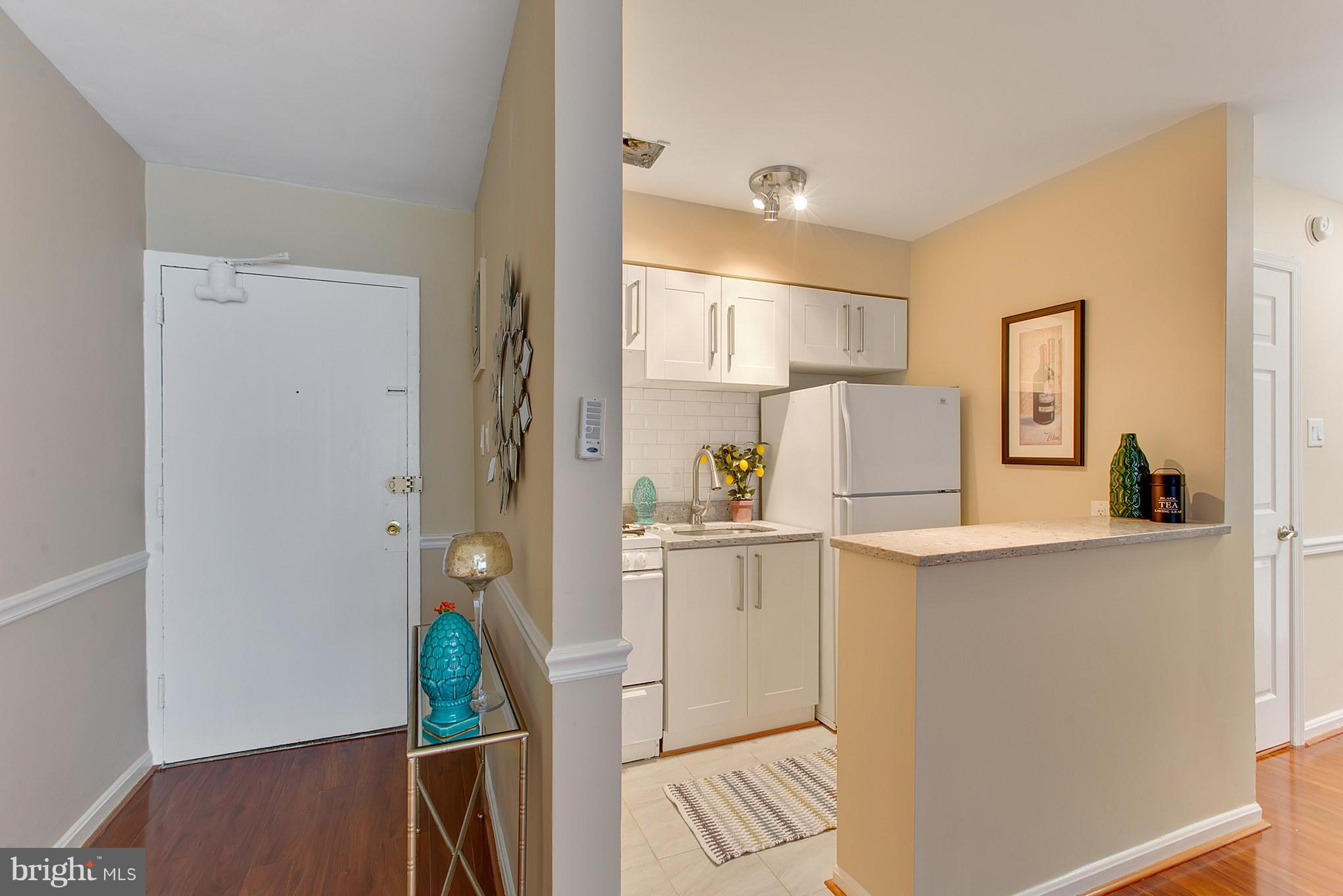 513 12th Street Northeast, Unit 3 Washington, DC 20002 - Photo 4 of 11 a kitchen with stainless steel appliances a refrigerator and a stove