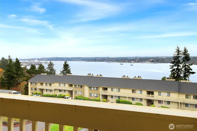 a front view of a residential apartment building with a yard