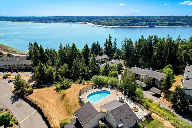 a view of a chair and tables in the backyard of the house