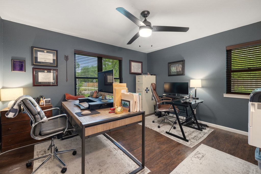 302 South Schramm Road Granger, TX 76530 - Photo 18 of 33 a view of a workspace with furniture and a window