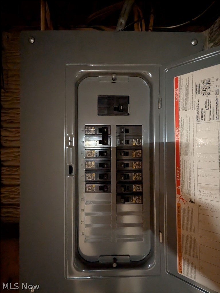 1161 Gulf Road Elyria, OH 44035 - Photo 28 of 34 Electrical service panel with a gray metal housing and multiple circuit breakers