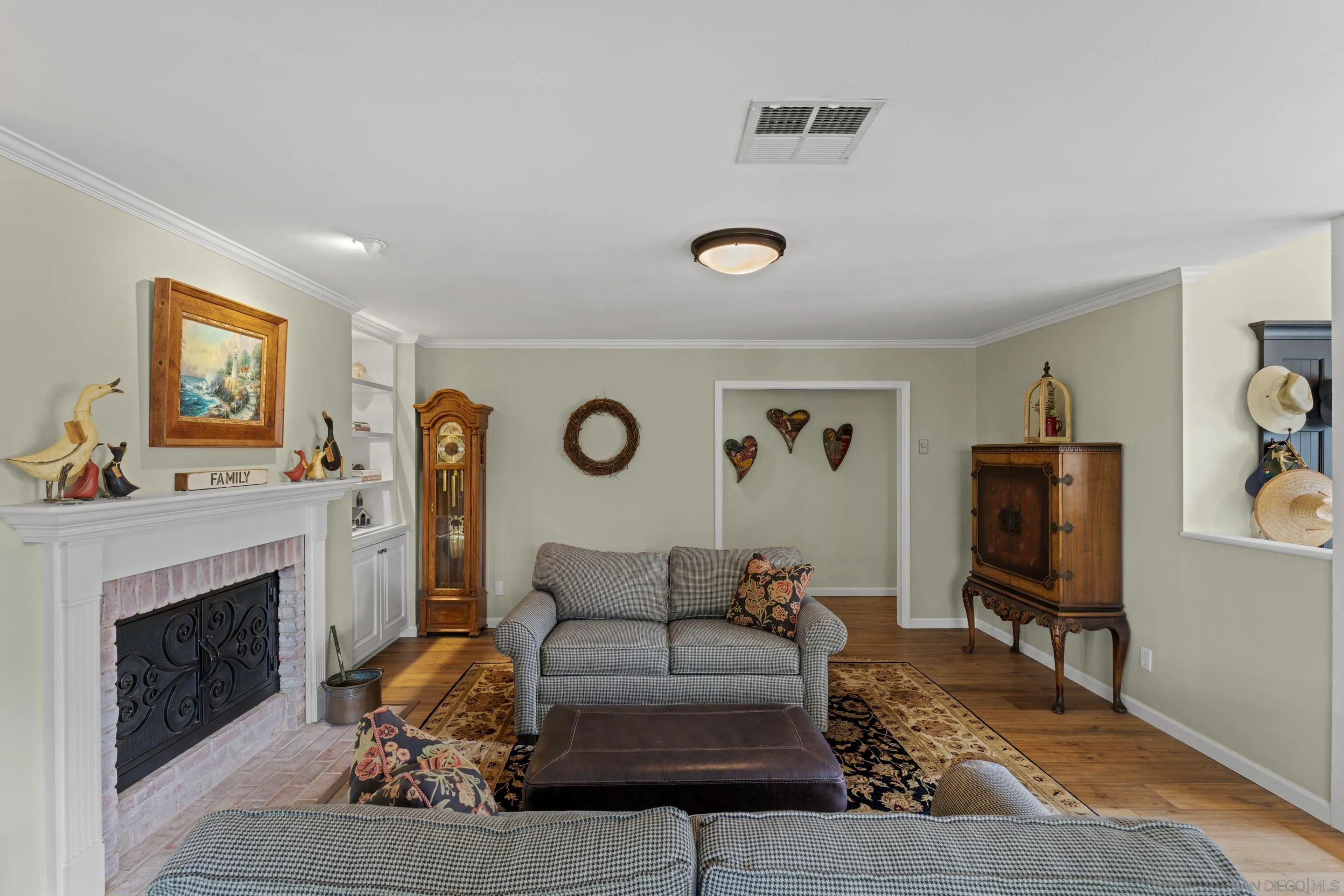 16327 Woodson View Road Poway, CA 92064 - Photo 4 of 54 a living room with furniture and a fireplace